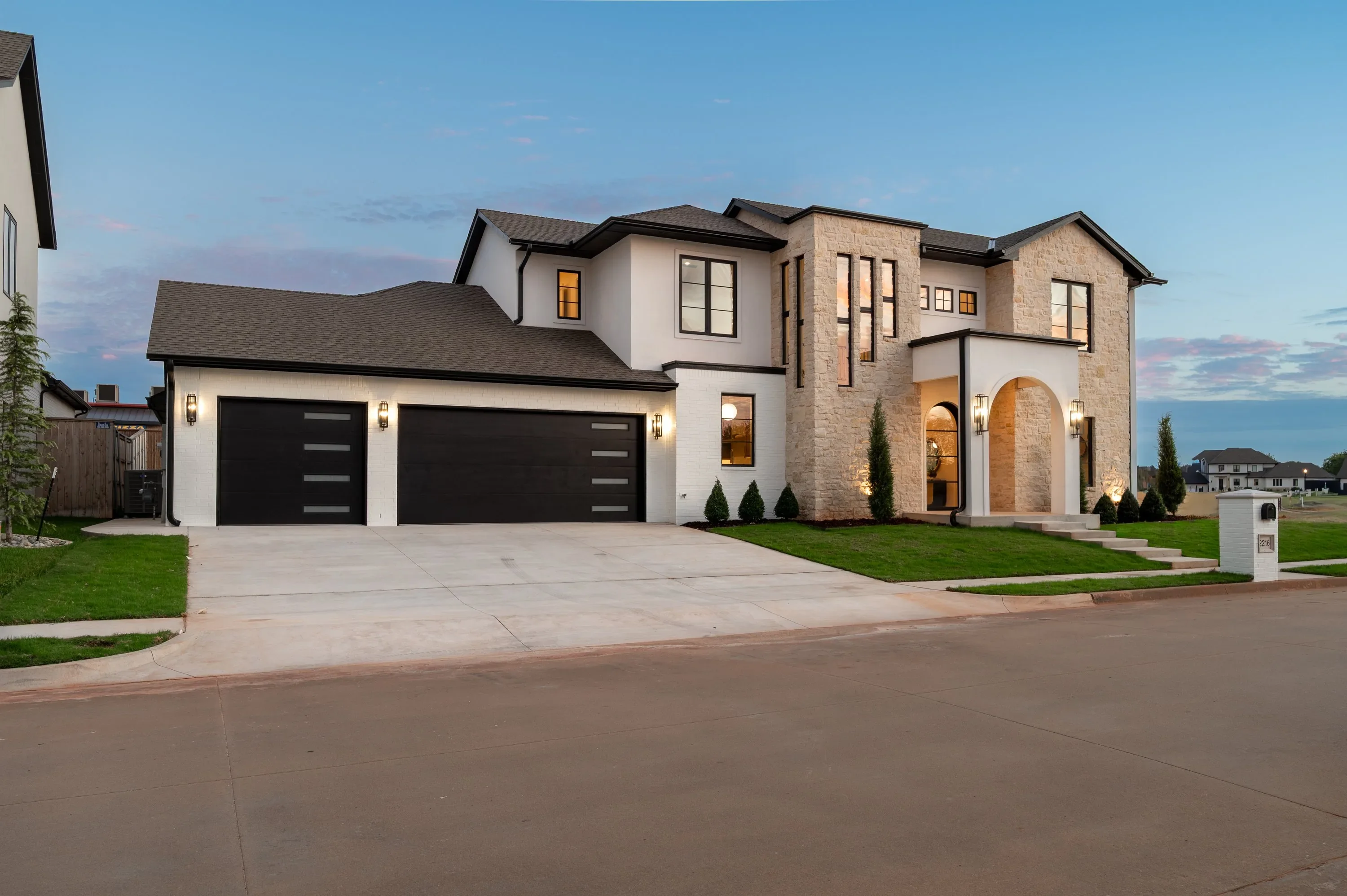 Angled front exterior of 2216 Stone Mill Ct at dusk