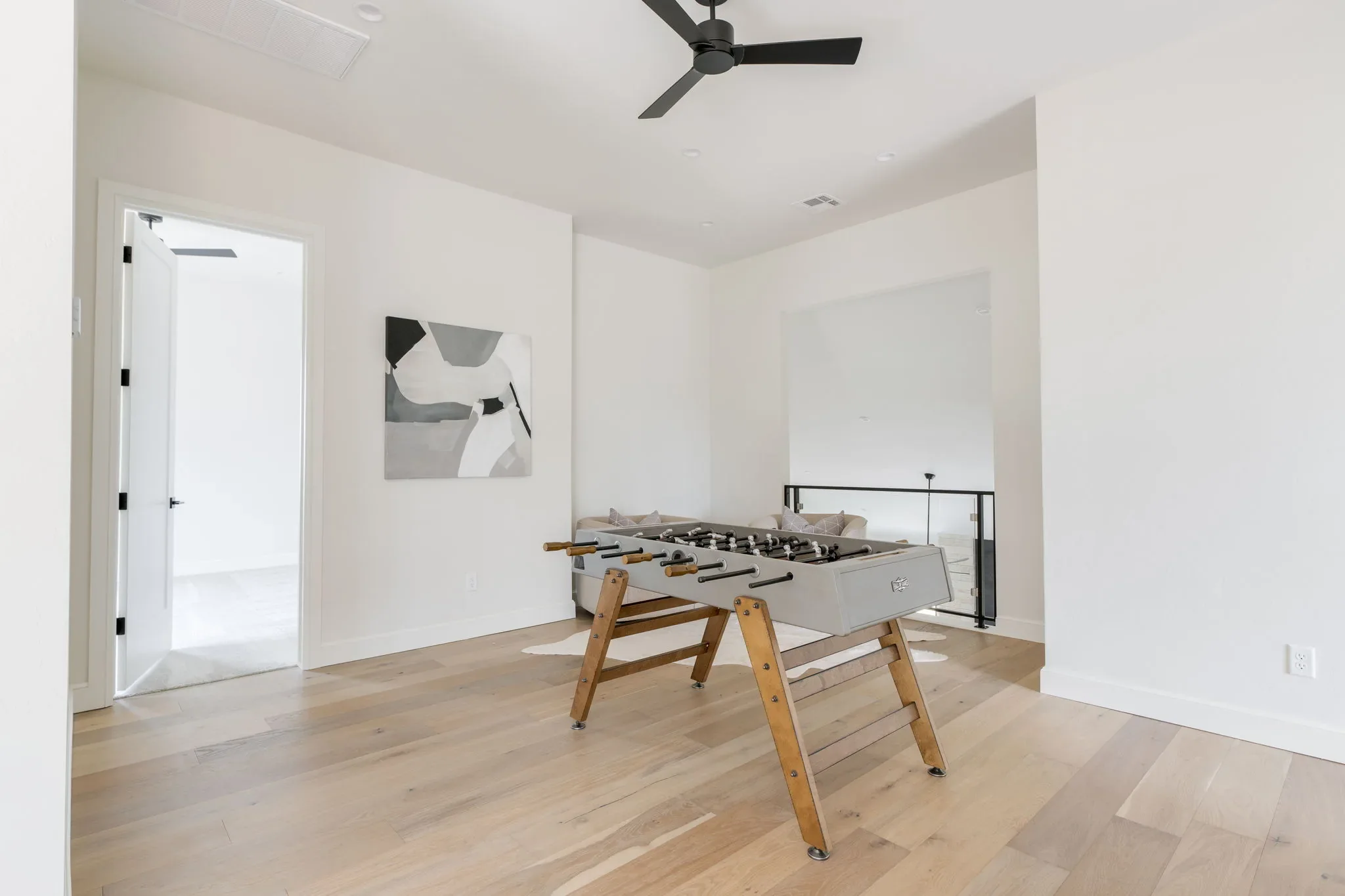 Upstairs bonus room with a foosball table
