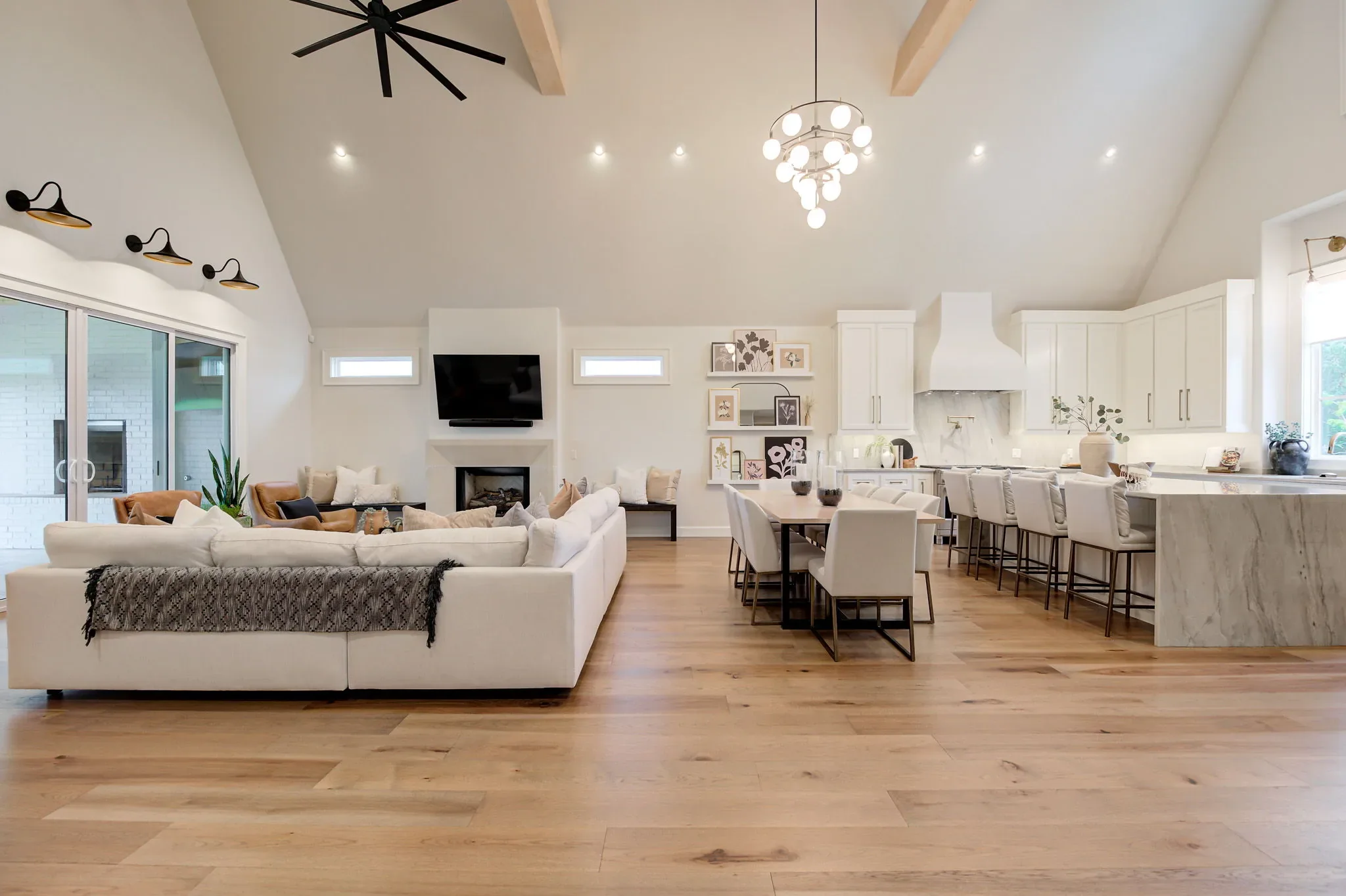 Open great room with living, dining, and kitchen areas