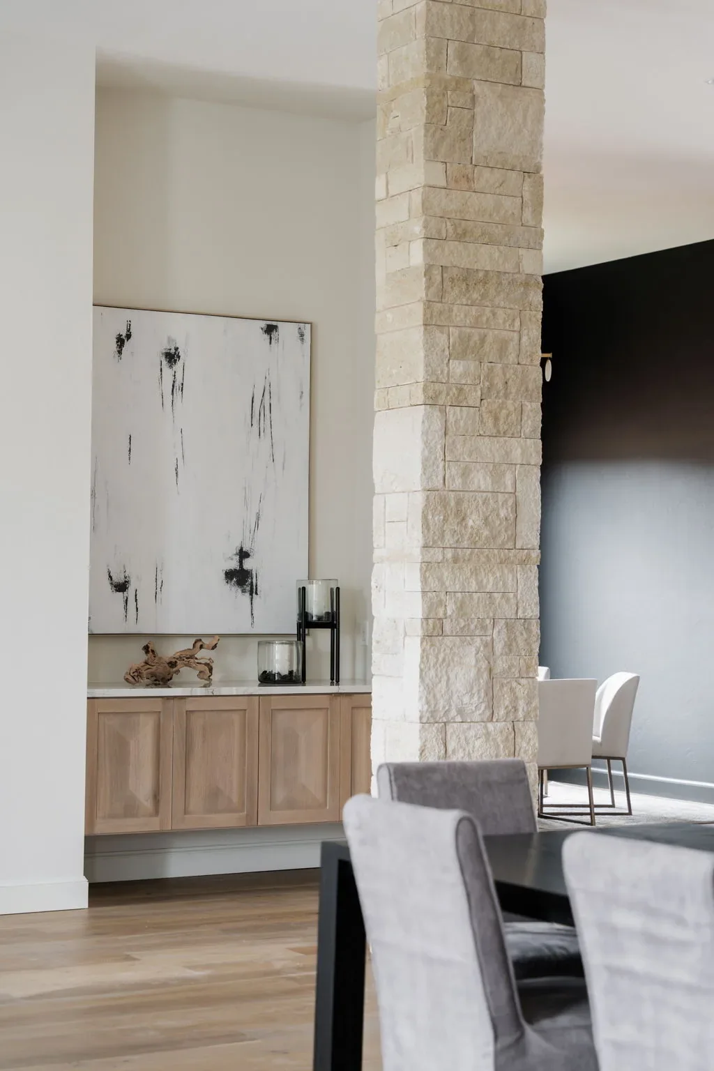 Dining room built-in buffet framed by a stone column