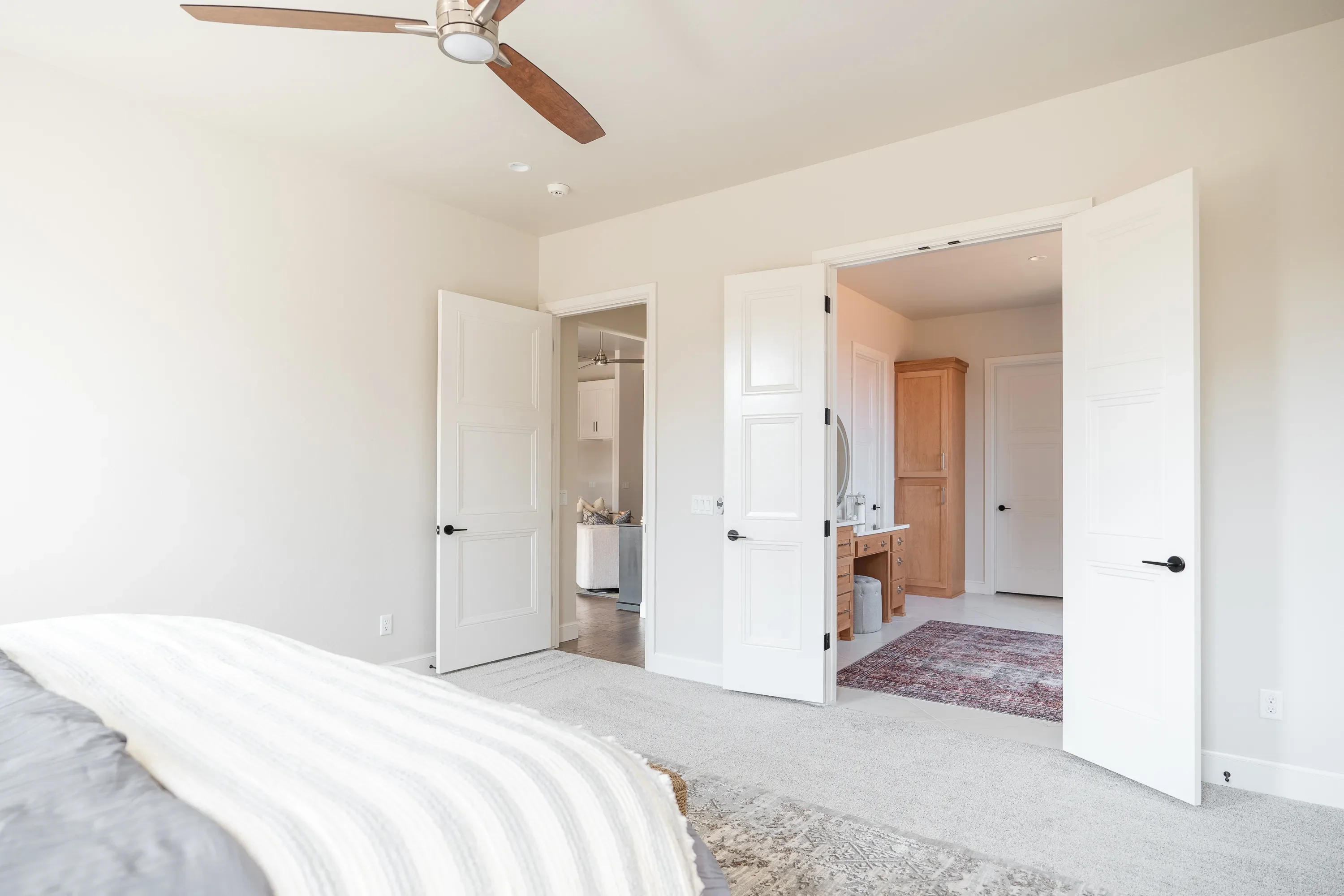 Primary bedroom opening into the ensuite bathroom