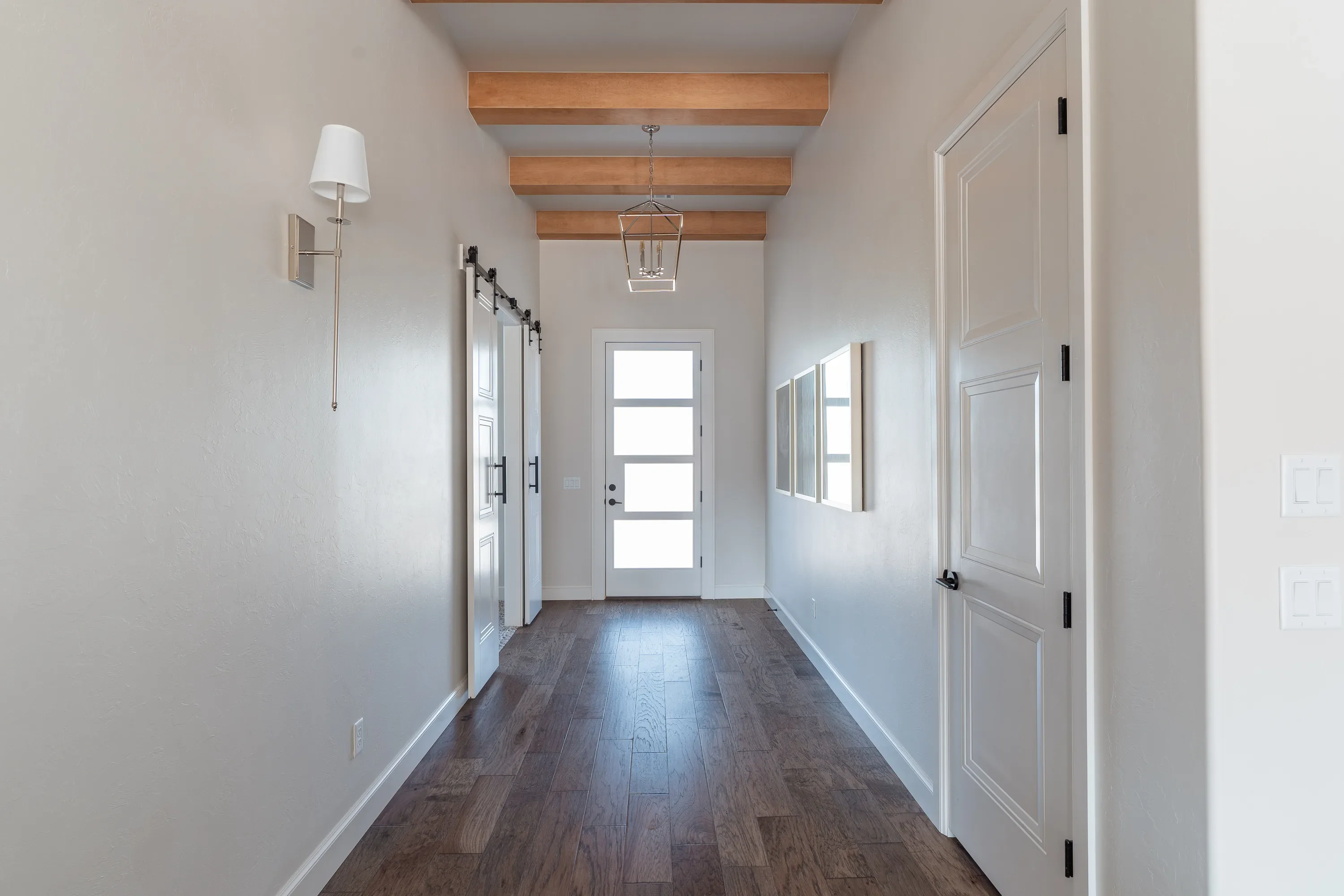 Entry hallway with exposed wood ceiling beams