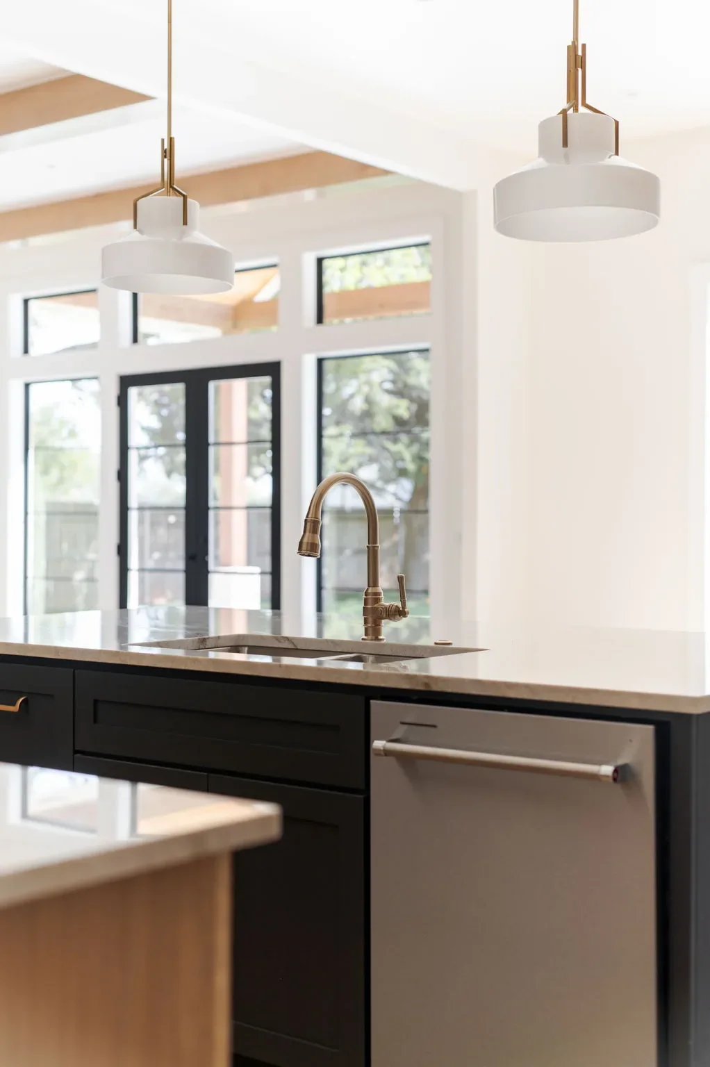 Kitchen island pendants with French doors overlooking the yard