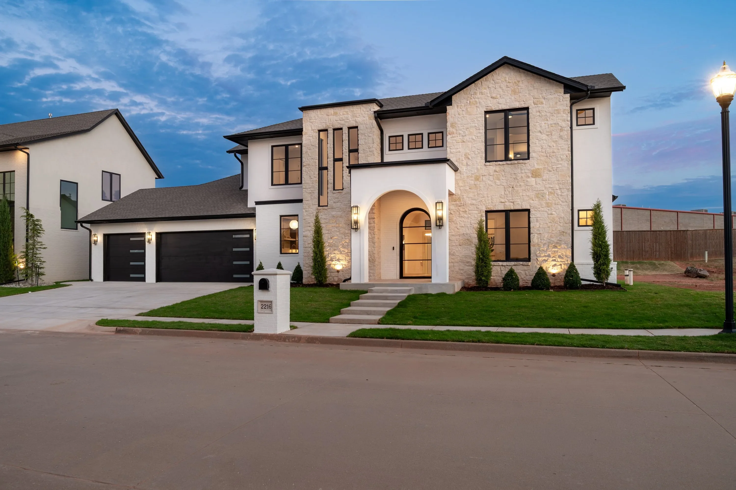 Front exterior of 2216 Stone Mill Ct illuminated at dusk