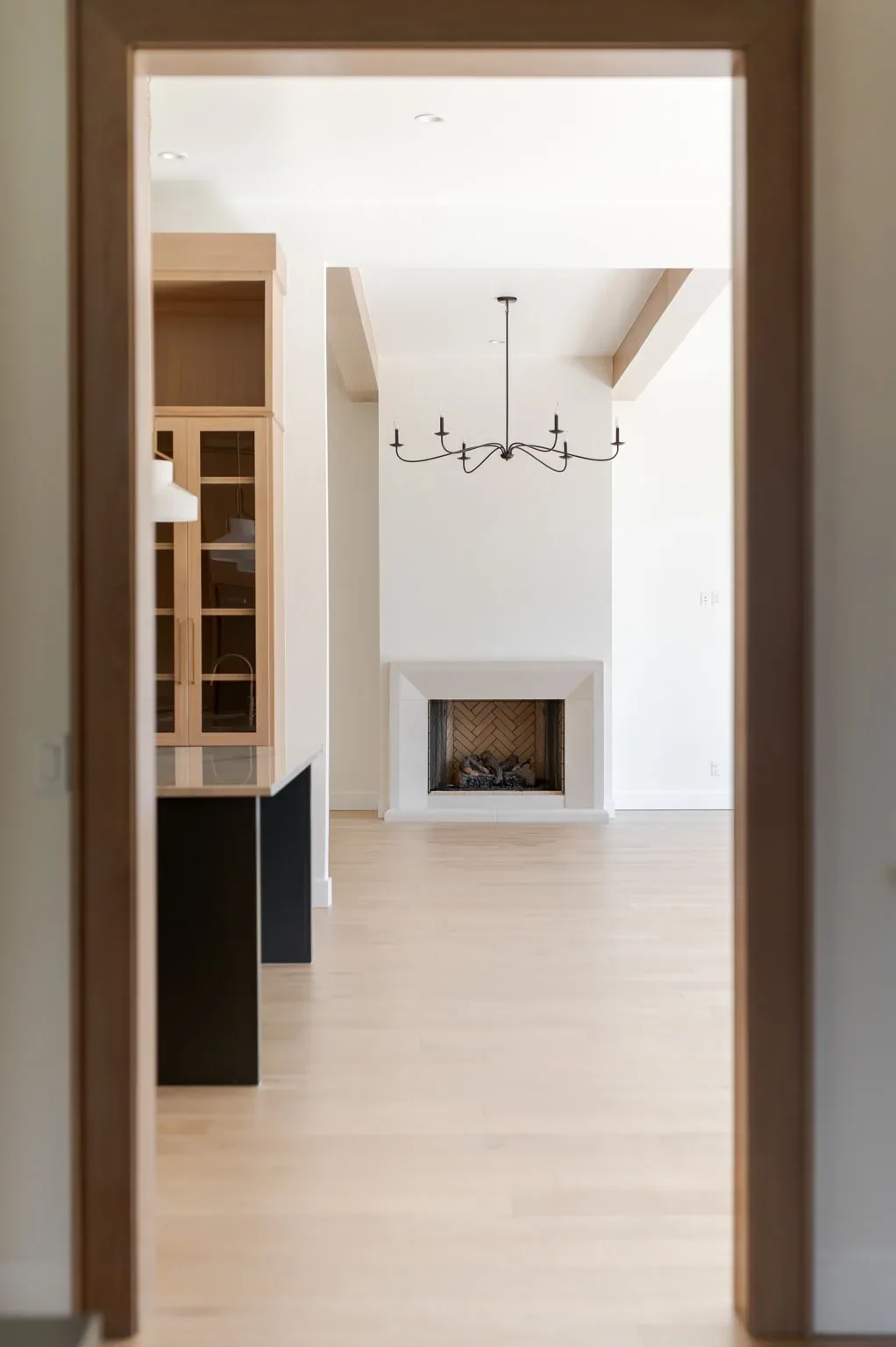 Doorway sightline into the beam-lined living room