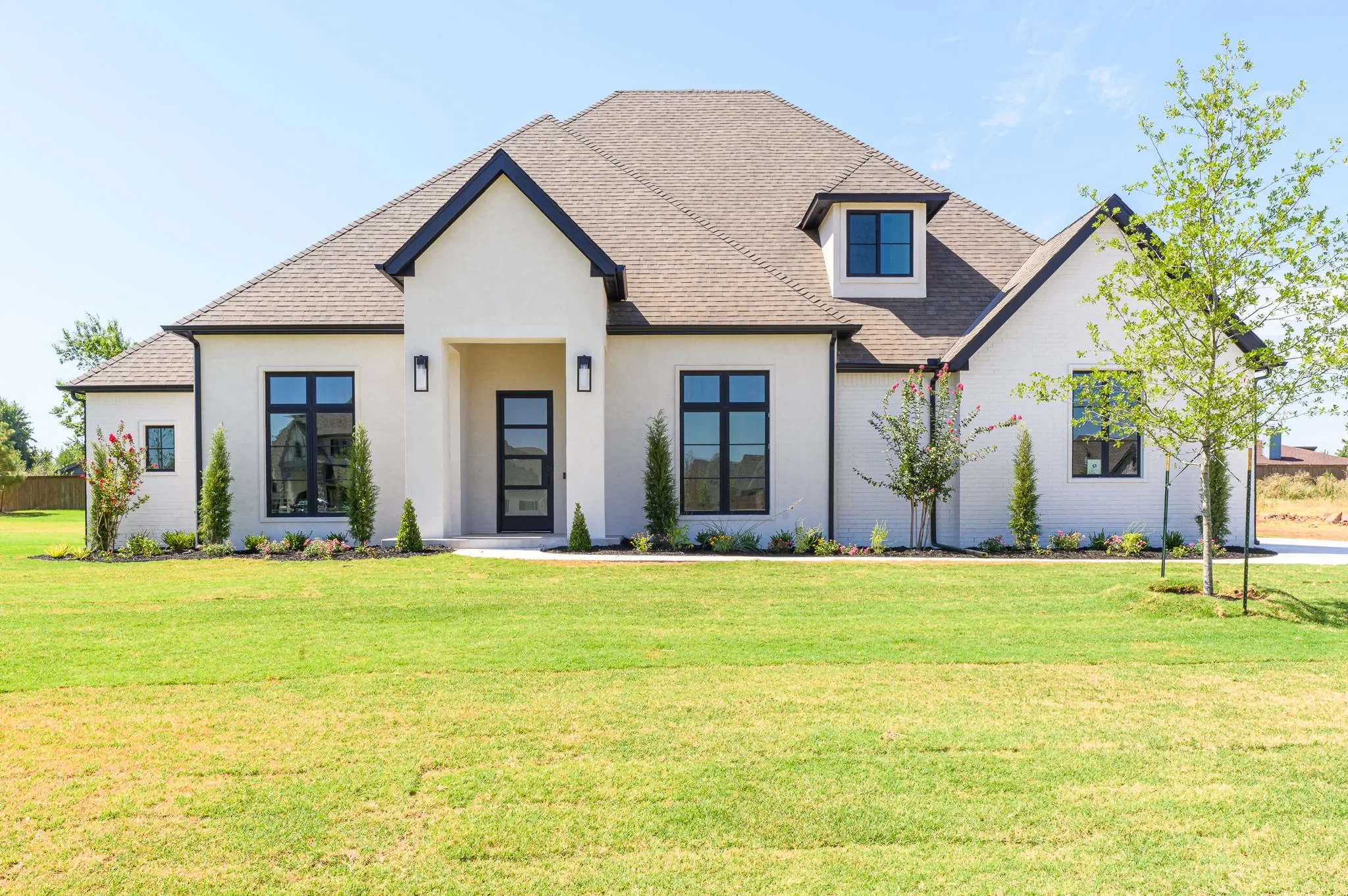 Front exterior of 1216 W. Pampas Way with white stucco and black trim