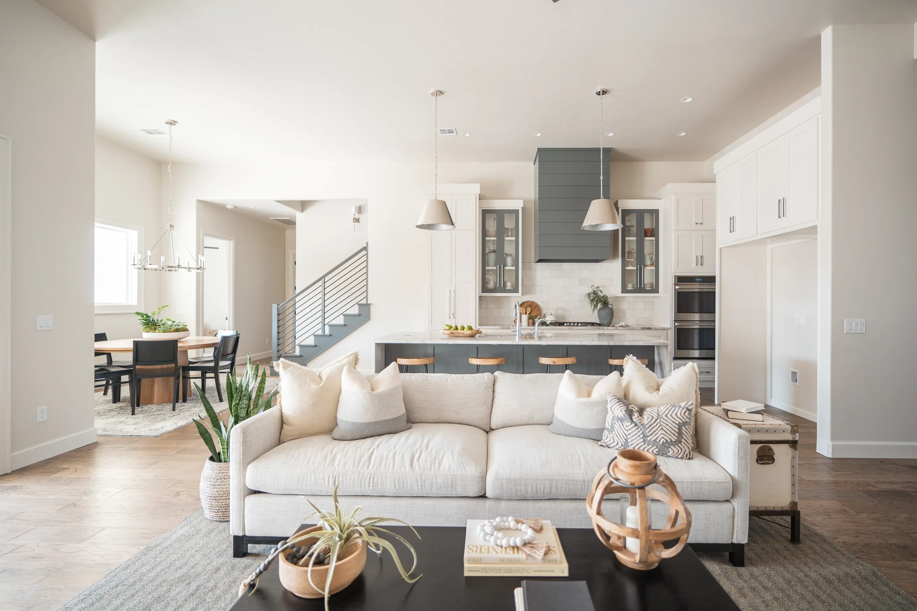 Open living room facing the waterfall-island kitchen