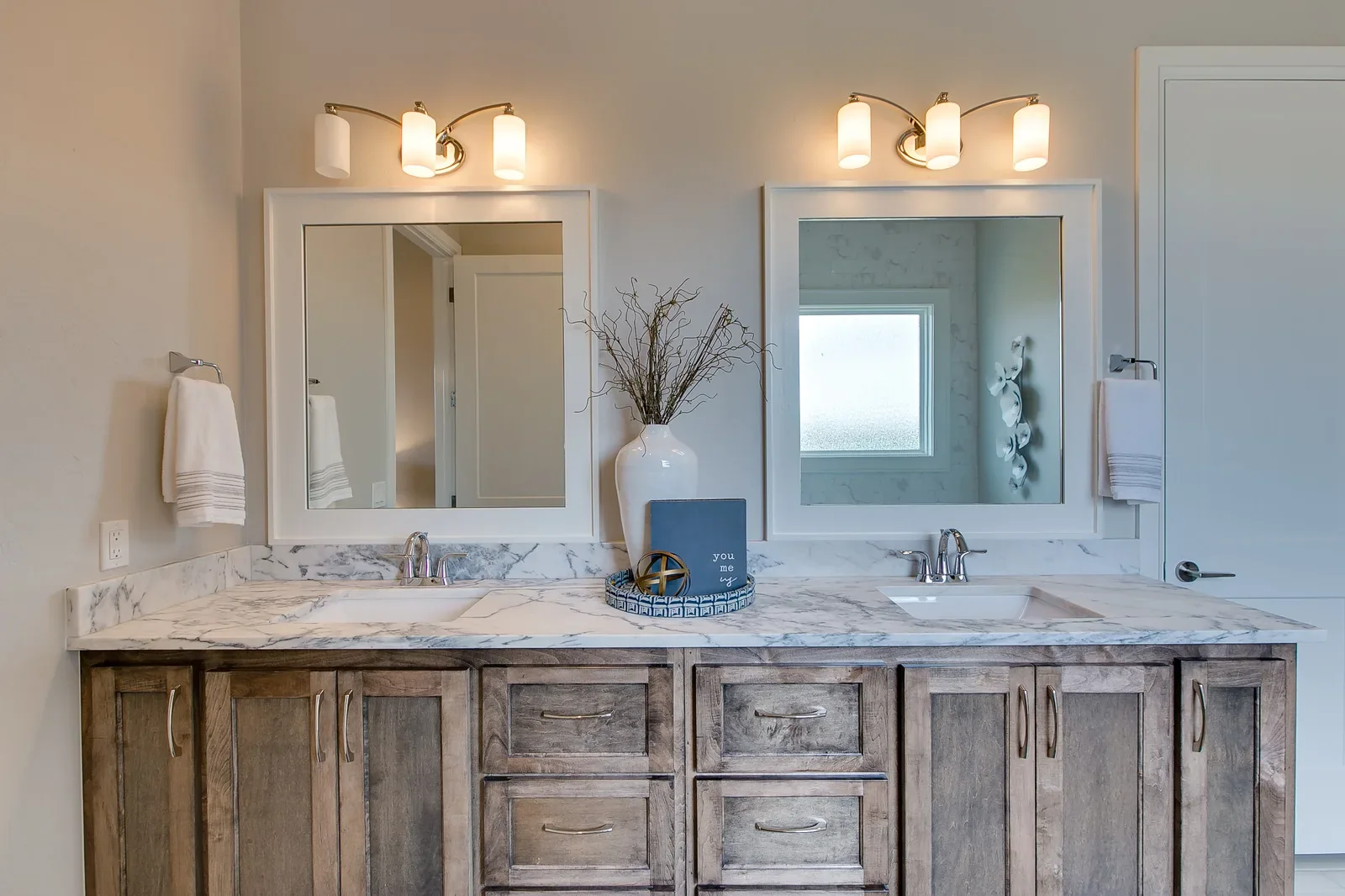 Bathroom with rustic wood double vanity and marble countertop