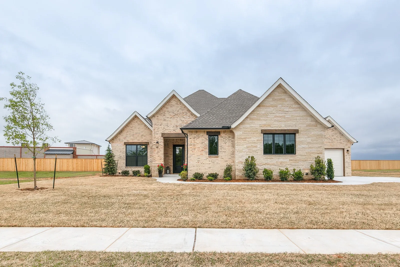Front exterior of 2312 Stone Mill Ct with stone-and-brick facade